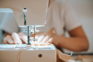 Woman sewing face mask for corona covid pandemic with sewing machine, Woman sewing face mask for corona covid pandemic with sewing machine,